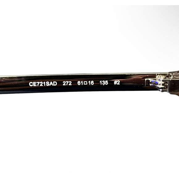 Chloé CE712S sunglasses feature a distinct brown and gold oversized round frame main image 11